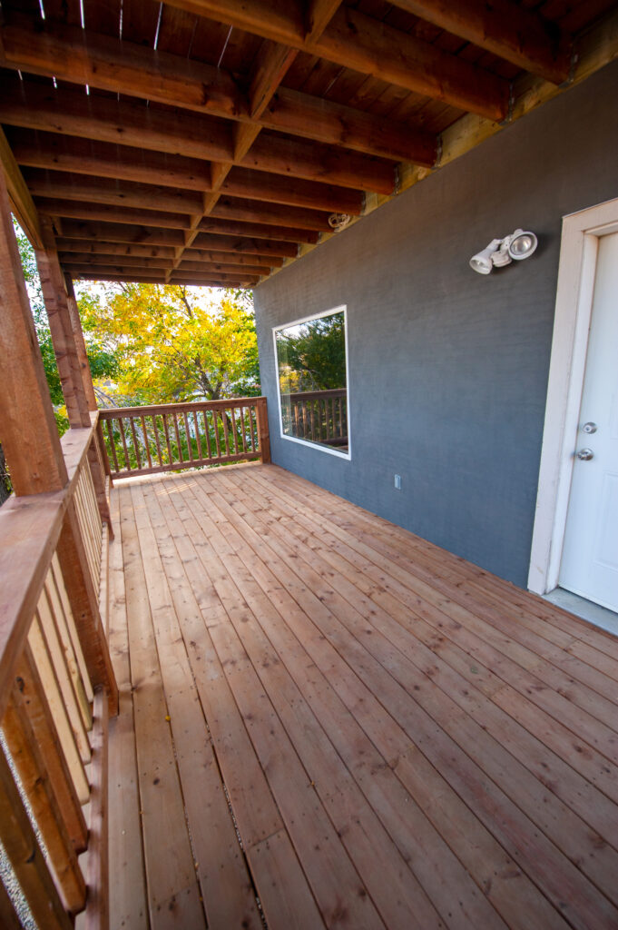 Exterior view of a double-deck with stairs, providing ample outdoor space.