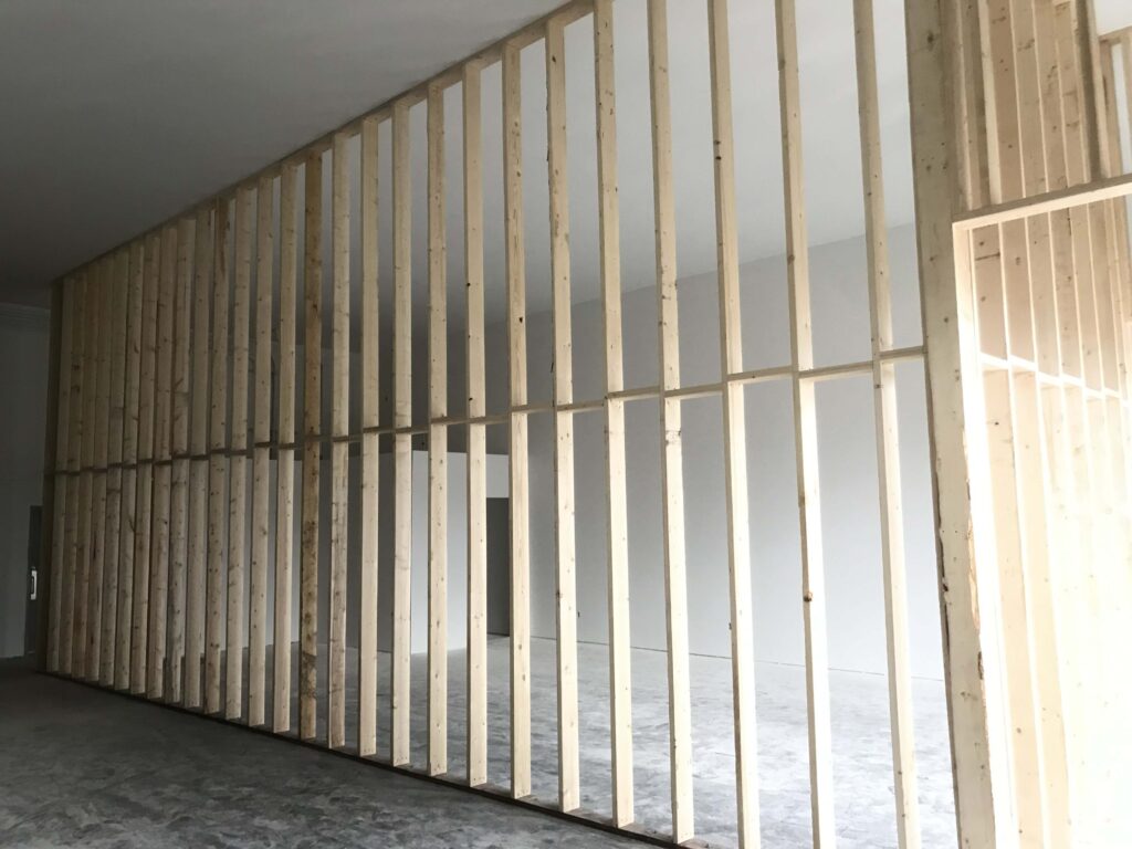 Wooden framing for high ceilings in a commercial construction project, showcasing Alberta Builder Services' craftsmanship in custom building solutions.