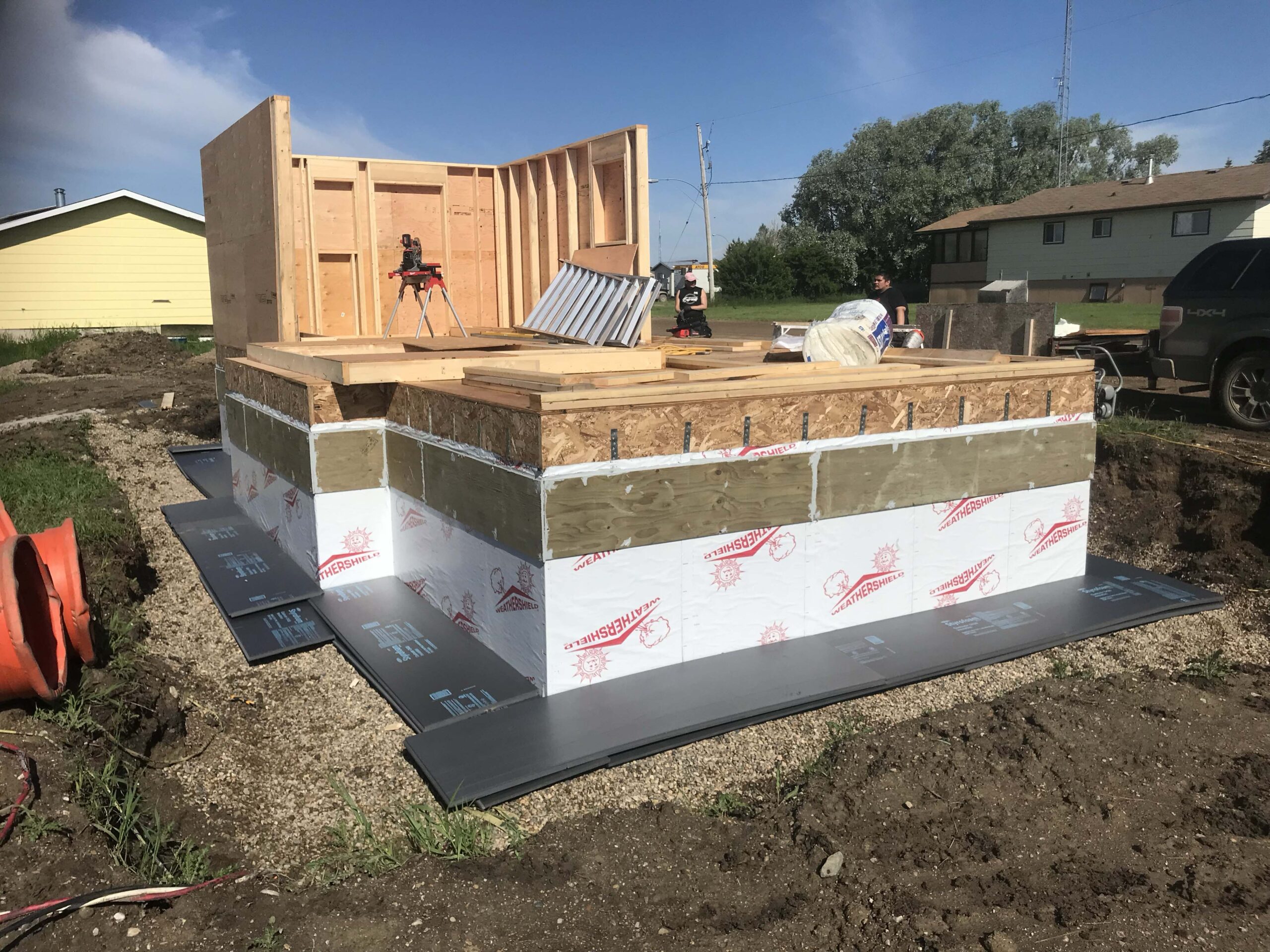 Construction of an insulated concrete form (ICF) foundation with floor framing in progress, highlighting Alberta Builder Services' custom building capabilities.