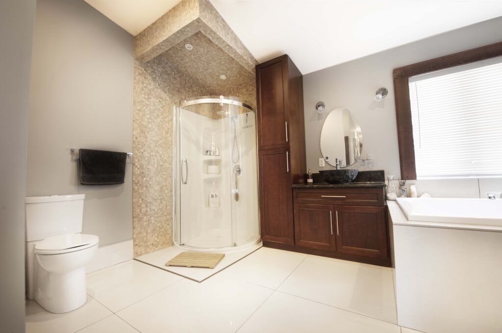 Luxurious master bathroom with a corner shower, dark wood cabinetry, and a large soaking tub.