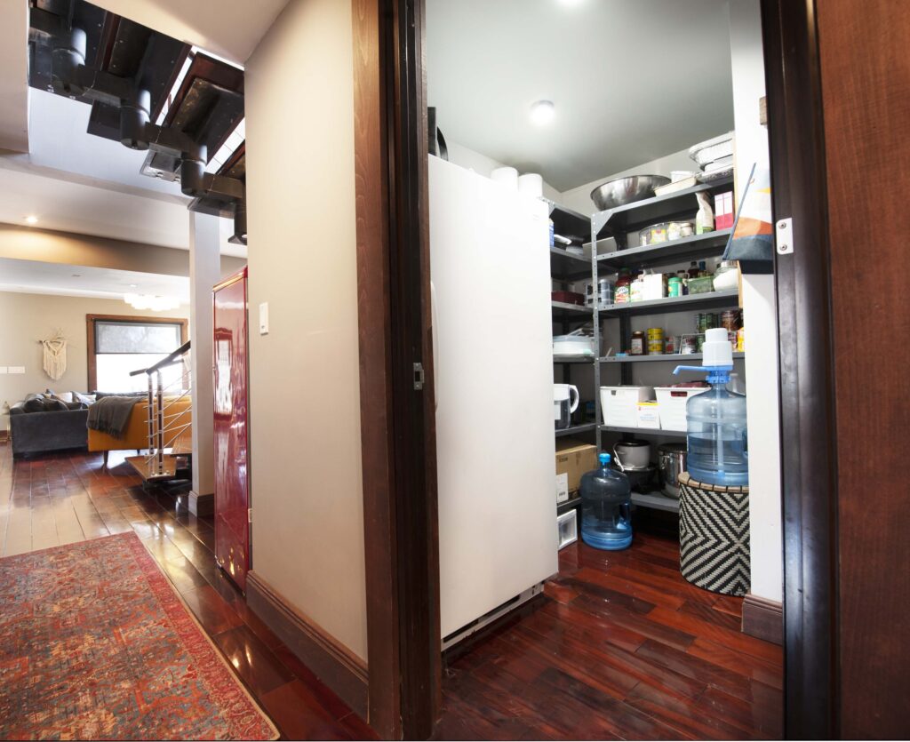 Spacious pantry with organized shelving and modern storage solutions.