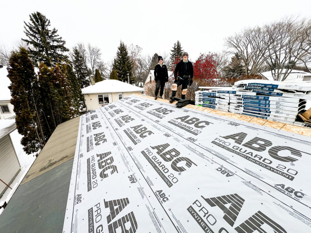 Garage roofing preparation in Edmonton showing synthetic roof underlayment installed before asphalt shingles by Alberta Builder Services