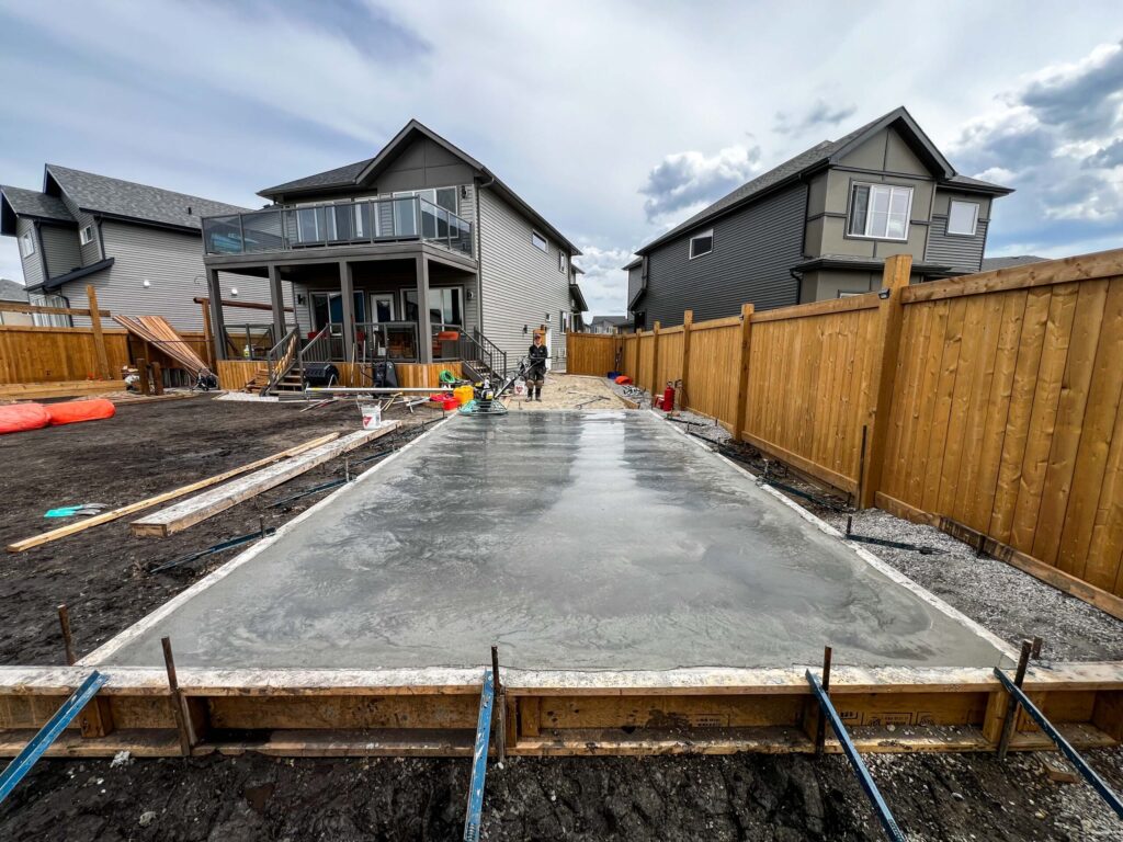 Concrete slab foundation for a custom oversized detached backyard shed in the Greater Edmonton area by Alberta Builder Services Ltd.