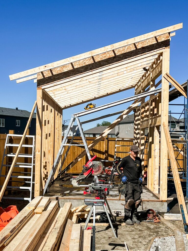 Construction of a custom oversized detached backyard shed during structural framing in the Greater Edmonton area by Alberta Builder Services Ltd.