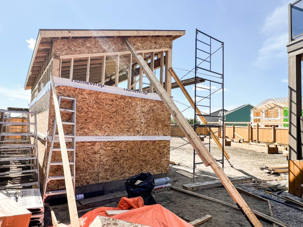 Custom oversized detached backyard shed during framing with shed roof and clerestory window openings in the Greater Edmonton area by Alberta Builder Services Ltd.